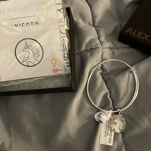 Alex and any unicorn charm bracelet with tags